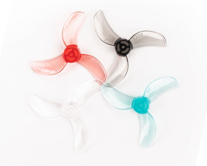 A set of Gemfan 1208-3 31mm 3-blade propellers in red, clear, and blue colors, displayed in four pairs.